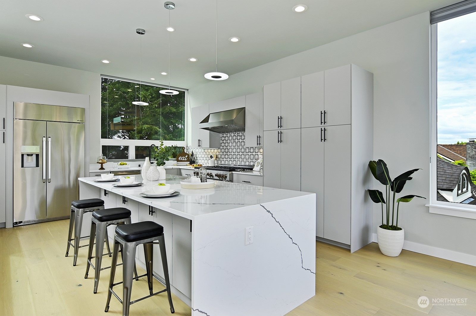 2707 South Ferdinand Street Seattle, WA 98108 - Photo 19 of 38 a kitchen with a sink and chairs