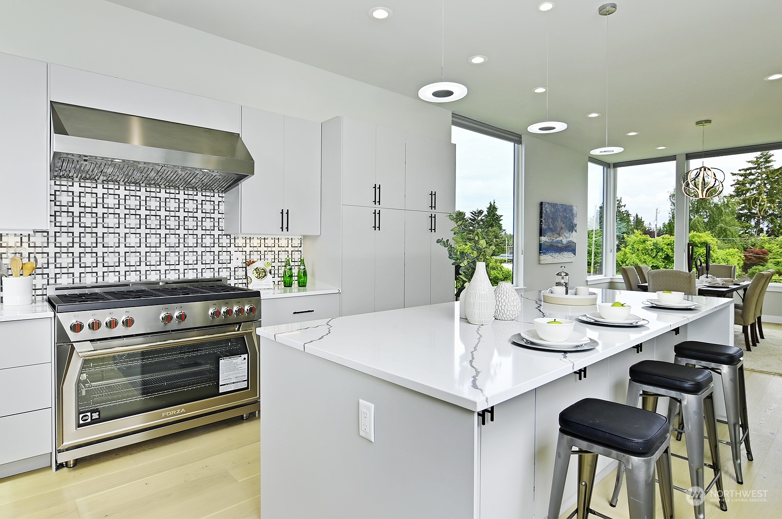 2707 South Ferdinand Street Seattle, WA 98108 - Photo 21 of 38 a kitchen with a stove and white cabinets