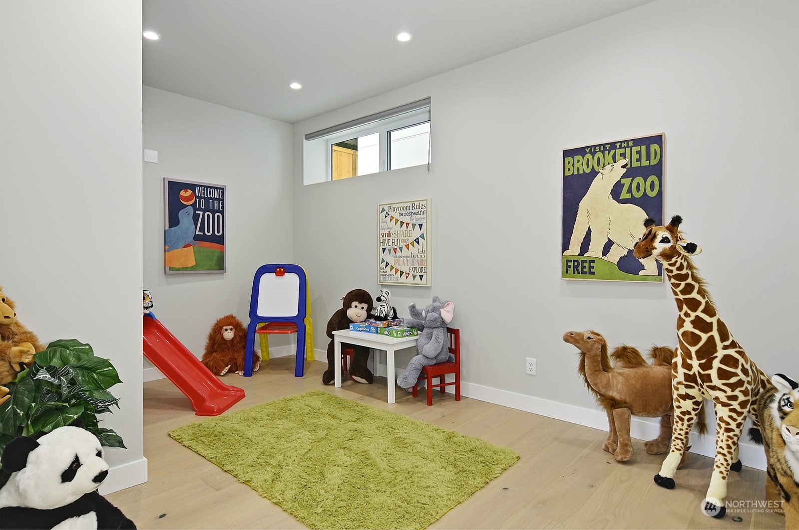 2707 South Ferdinand Street Seattle, WA 98108 - Photo 24 of 38 a bedroom with furniture and a wooden floor
