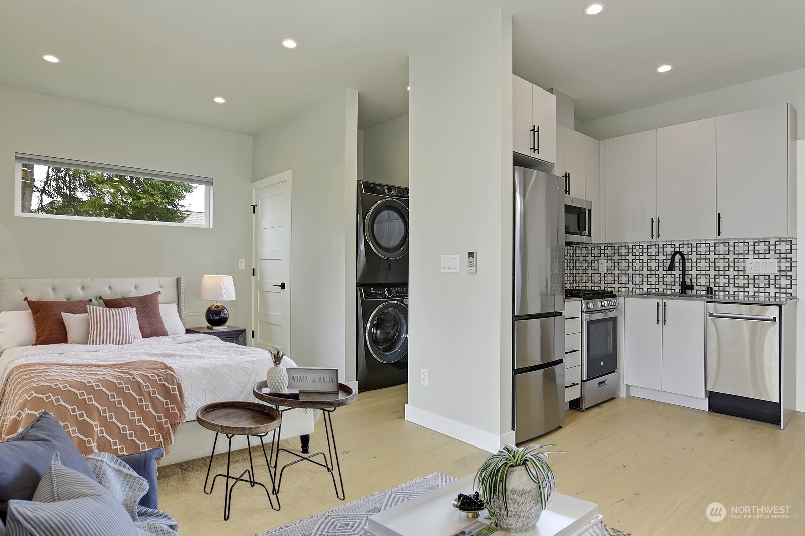 2707 South Ferdinand Street Seattle, WA 98108 - Photo 26 of 38 a bedroom with furniture and a large mirror