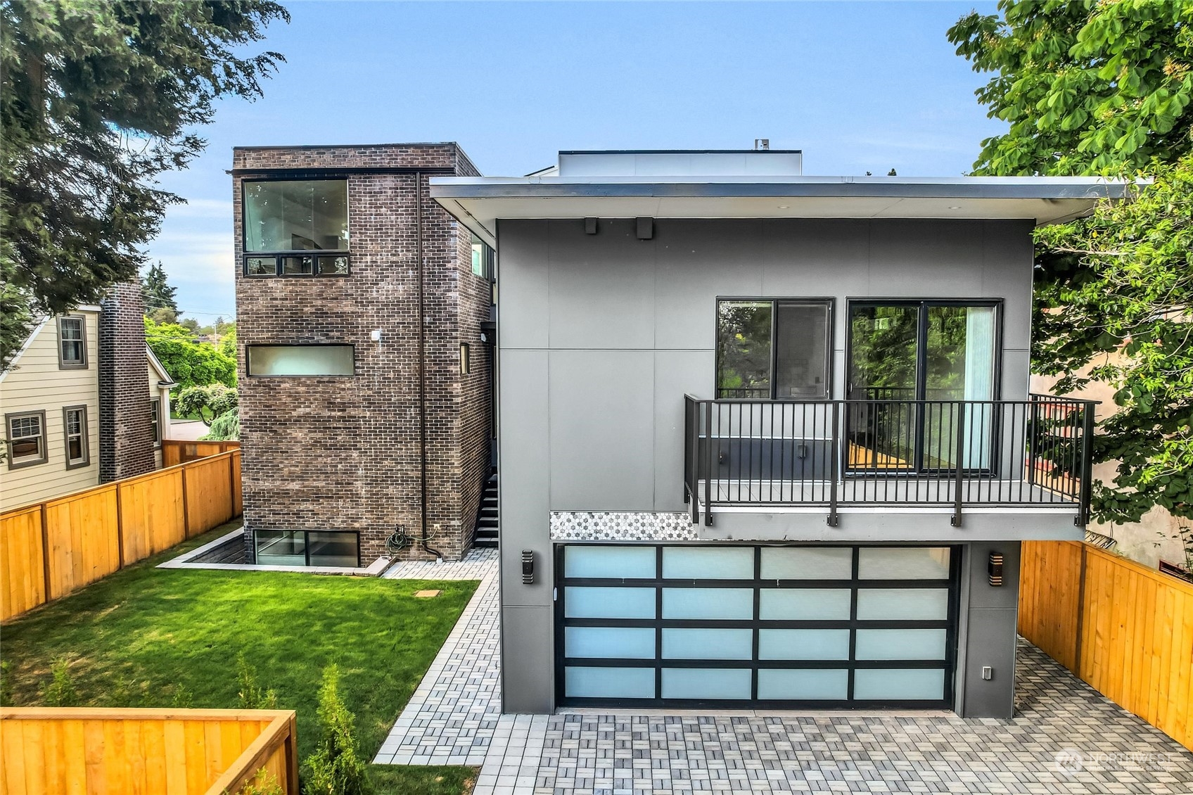 2707 South Ferdinand Street Seattle, WA 98108 - Photo 34 of 38 a view of a house with large windows and a small yard