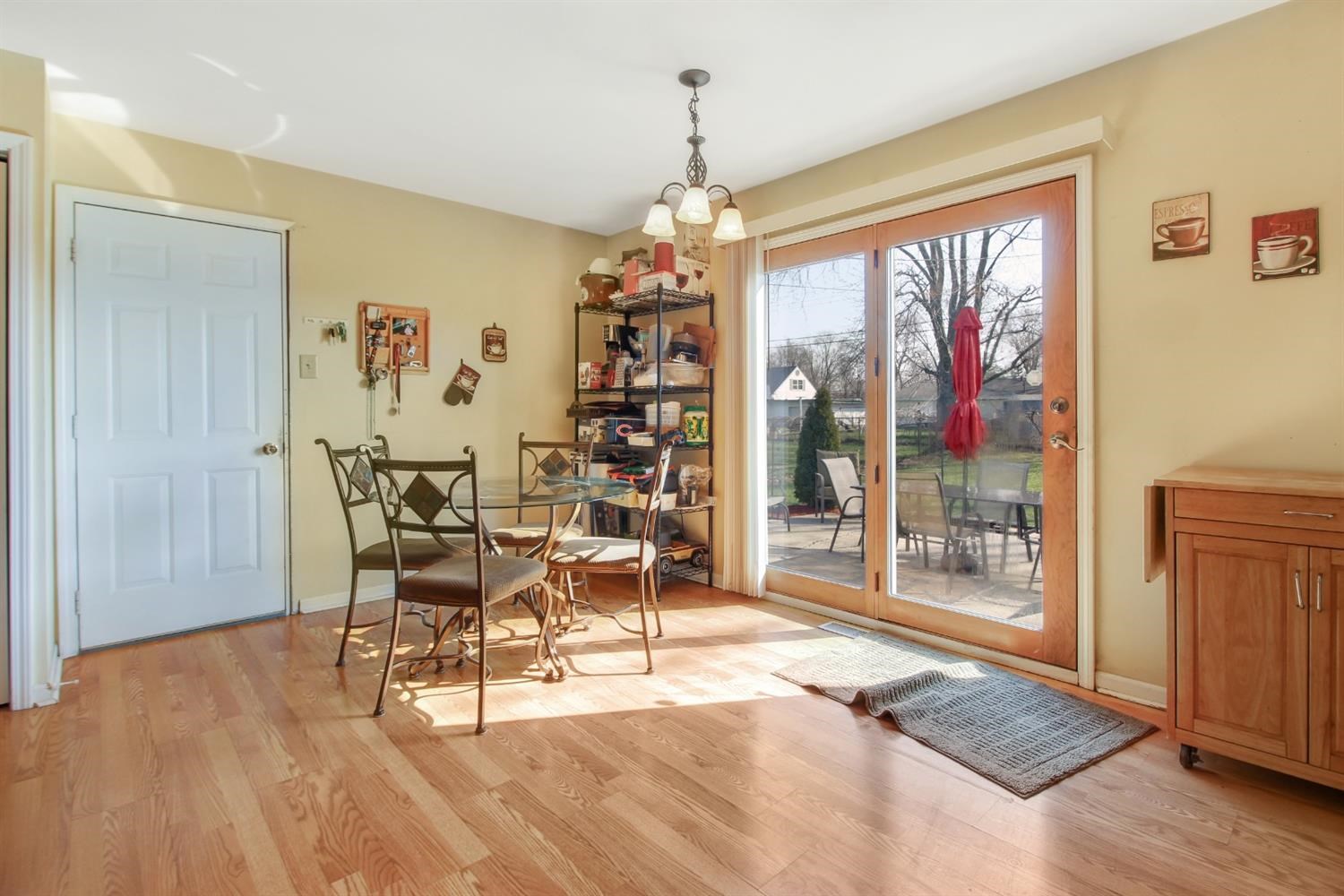 755 Fox River Road Valparaiso, IN 46385 - Photo 6 of 15 a dining room with furniture a chandelier and wooden floor