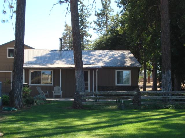 44433 Dee Knoch Road Fall River Mills, CA 96028 - Photo 1 of 9 a front view of house with yard and green space