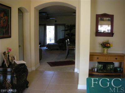 9017 Morris Road Fort Myers, FL 33967 - Photo 2 of 10 a living room with furniture and a fireplace