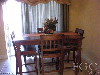 9017 Morris Road Fort Myers, FL 33967 - Photo 5 of 10 a view of a dining room with furniture and window