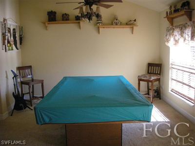 9017 Morris Road Fort Myers, FL 33967 - Photo 6 of 10 a room with a bed and a window