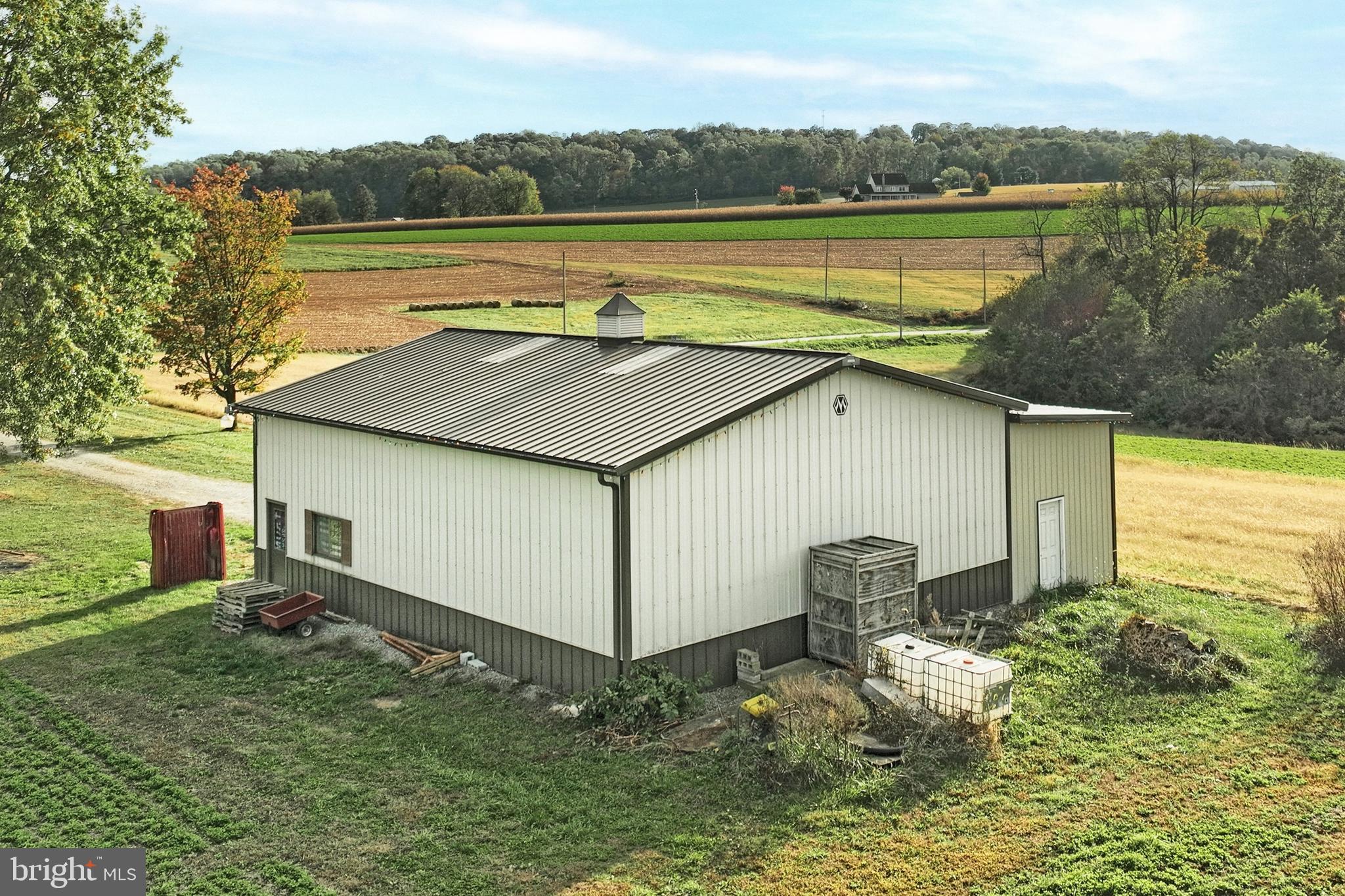 4877 Battlehill Road Brogue, PA 17309 - Photo 12 of 49 a view of a lake with a house in the background
