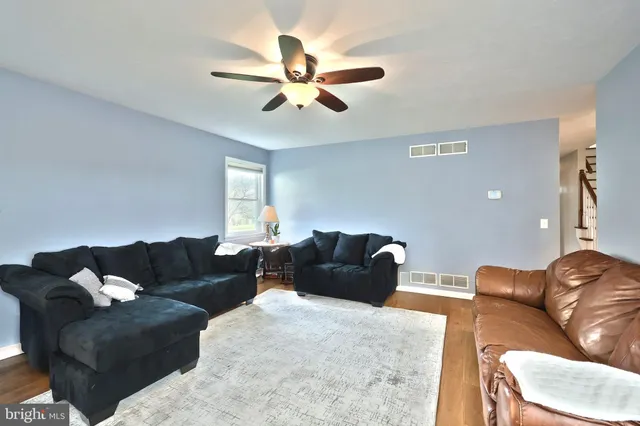 a bedroom with two beds and a chandelier