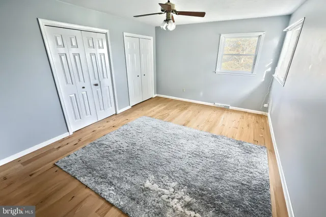 a room with a bed and a window