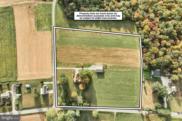 a view of a field with an ocean view