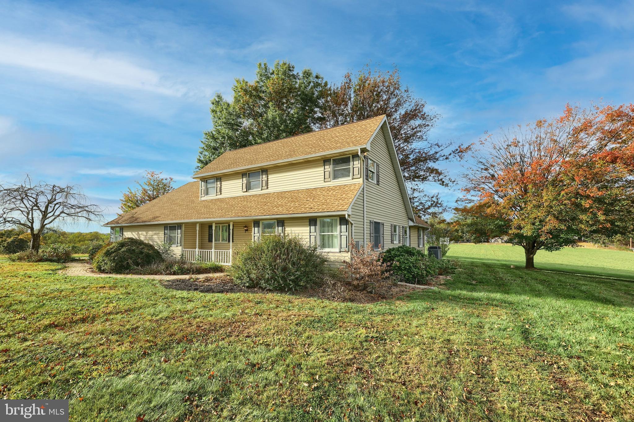 4877 Battlehill Road Brogue, PA 17309 - Photo 4 of 49 a front view of house with yard and green space
