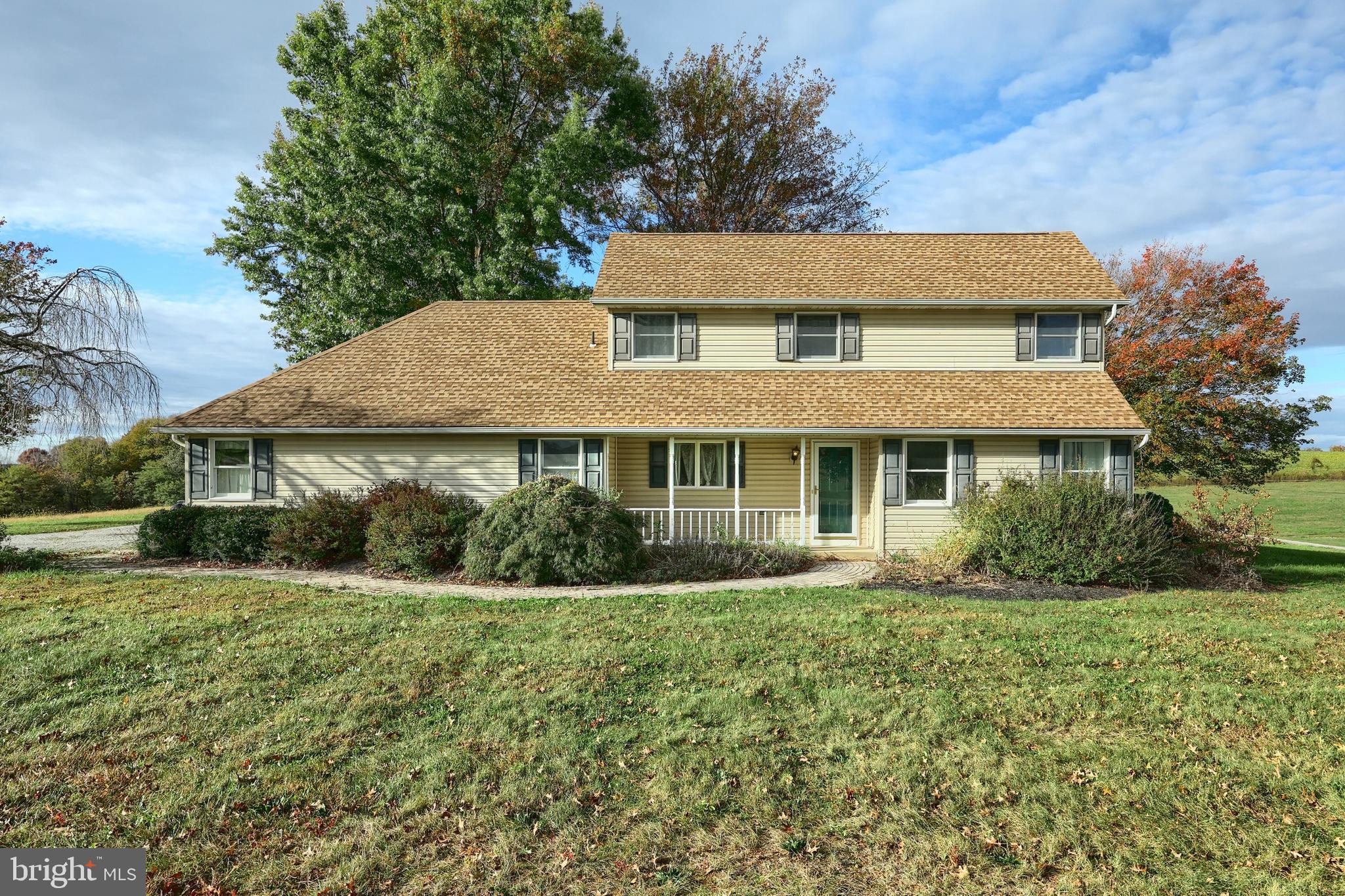 4877 Battlehill Road Brogue, PA 17309 - Photo 5 of 49 a front view of a house with a yard