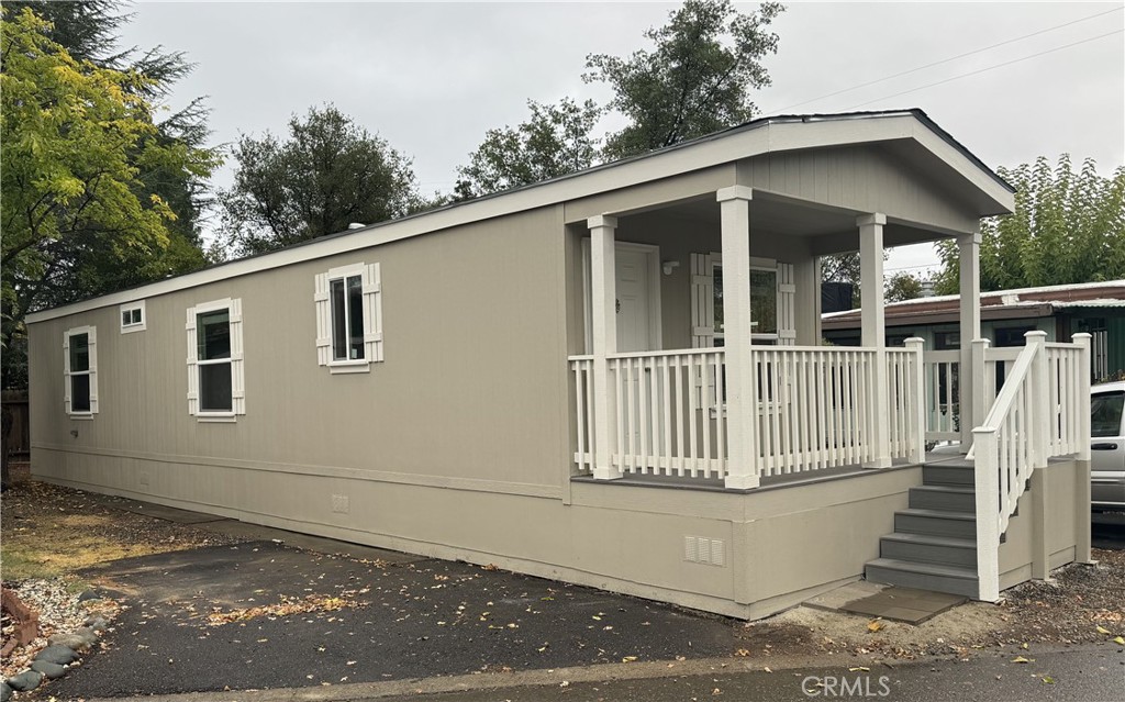 3390 Taylor Road, Unit 17 Loomis, CA 95650 - Photo 1 of 8 a view of a house with a yard and large window