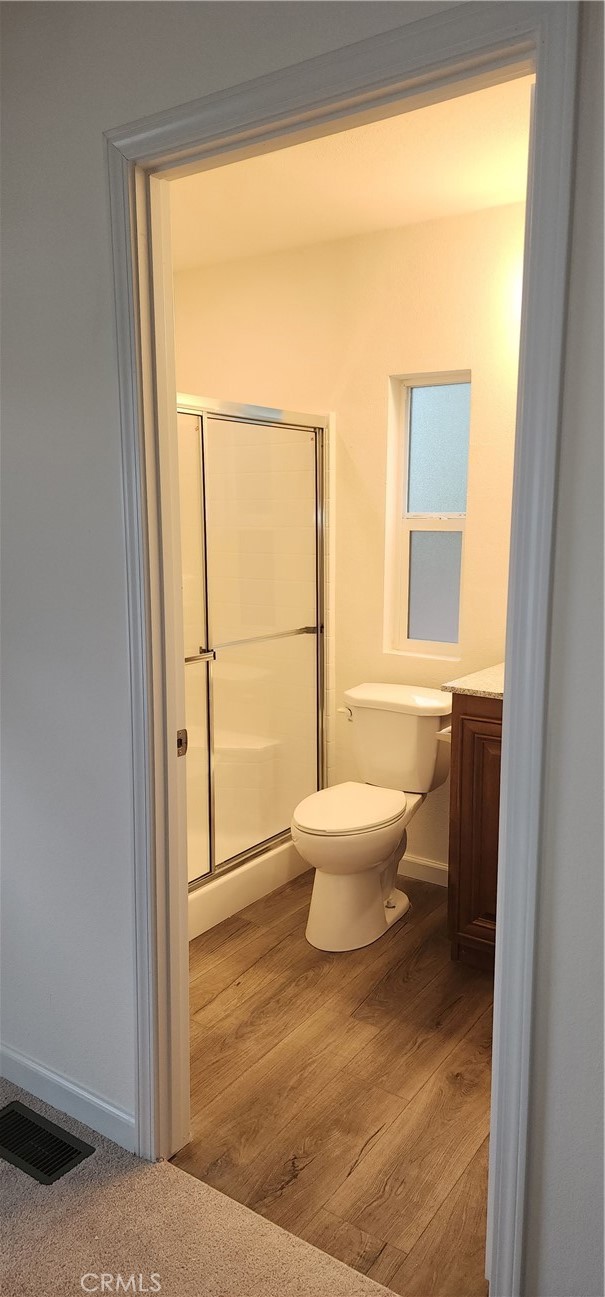 3390 Taylor Road, Unit 17 Loomis, CA 95650 - Photo 6 of 8 a bathroom with a toilet a window and a shower