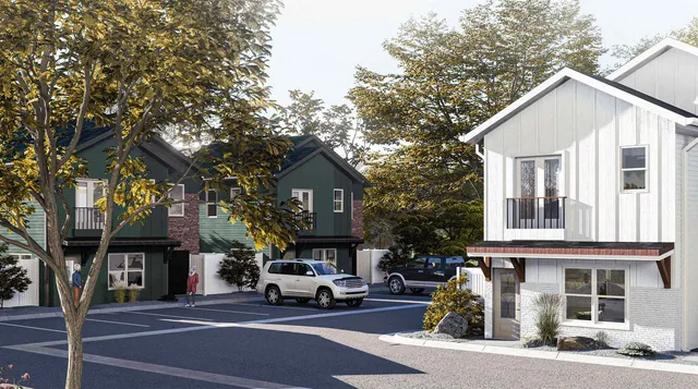 a view of a white house with a outdoor space