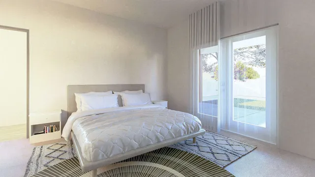 a bedroom with a bed and a window