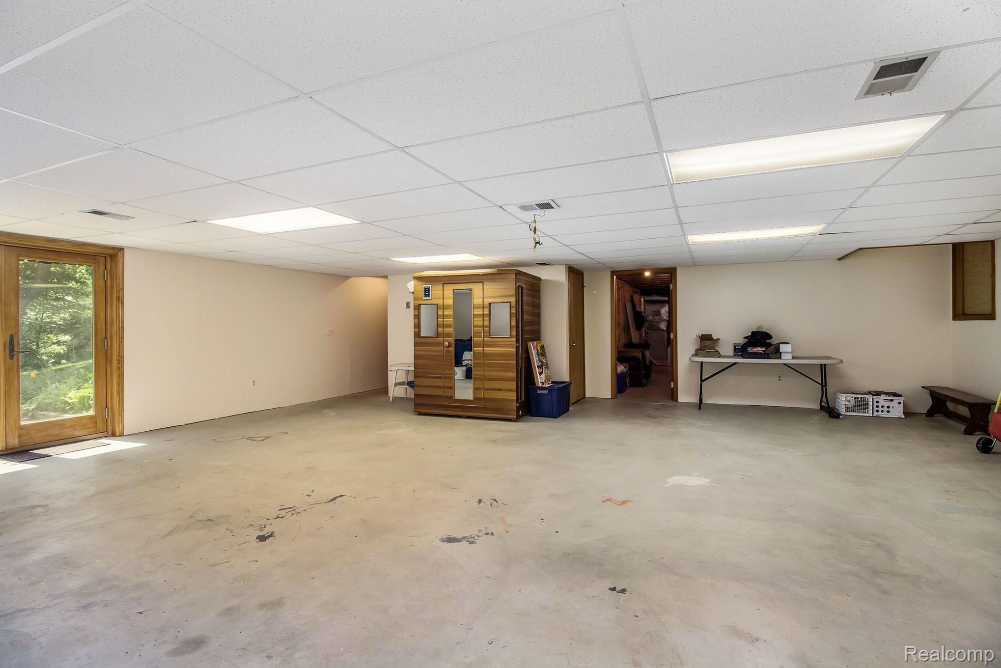 13171 Dunham Road Hartland, MI 48353 - Photo 34 of 61 Basement partly finished with walkout