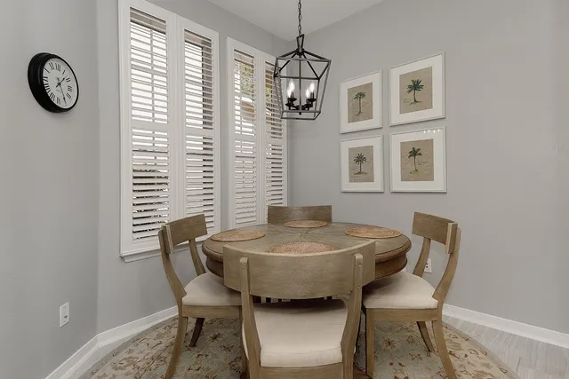 a dining room with furniture and window