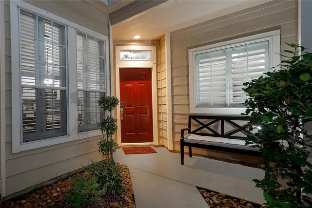 a view of a bench in front of house
