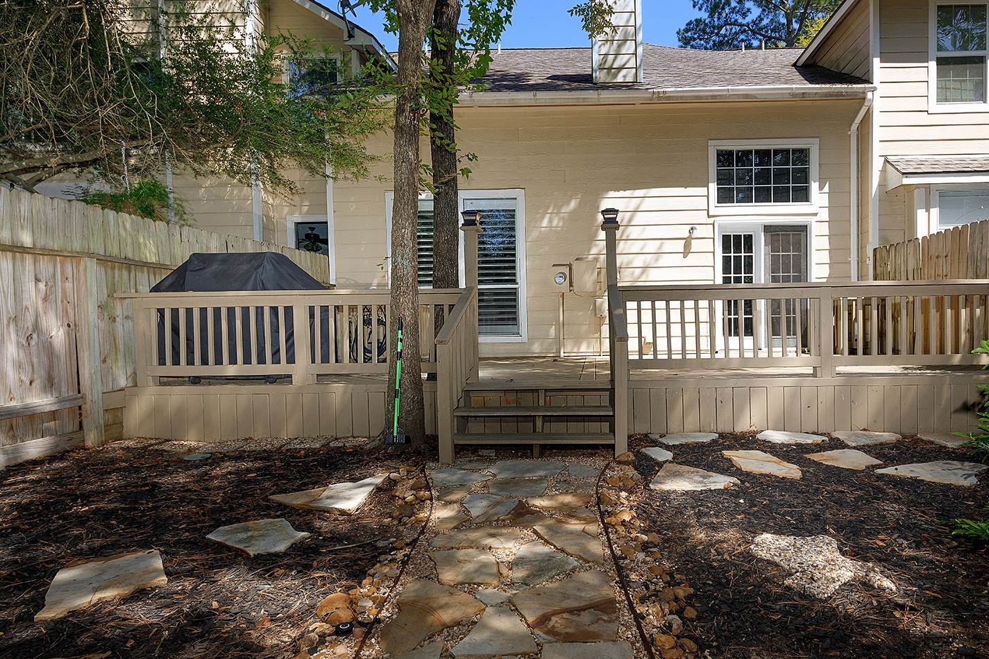 110 Wintergreen Trail The Woodlands, TX 77382 - Photo 28 of 32 a view of a deck with a yard