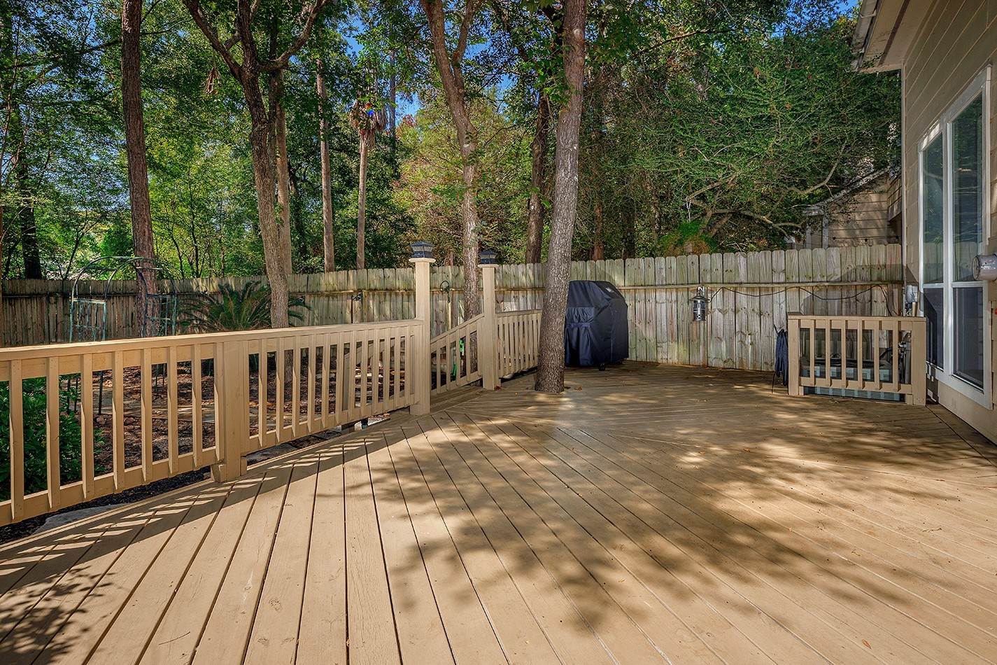 110 Wintergreen Trail The Woodlands, TX 77382 - Photo 29 of 32 a view of a balcony with wooden floor and fence