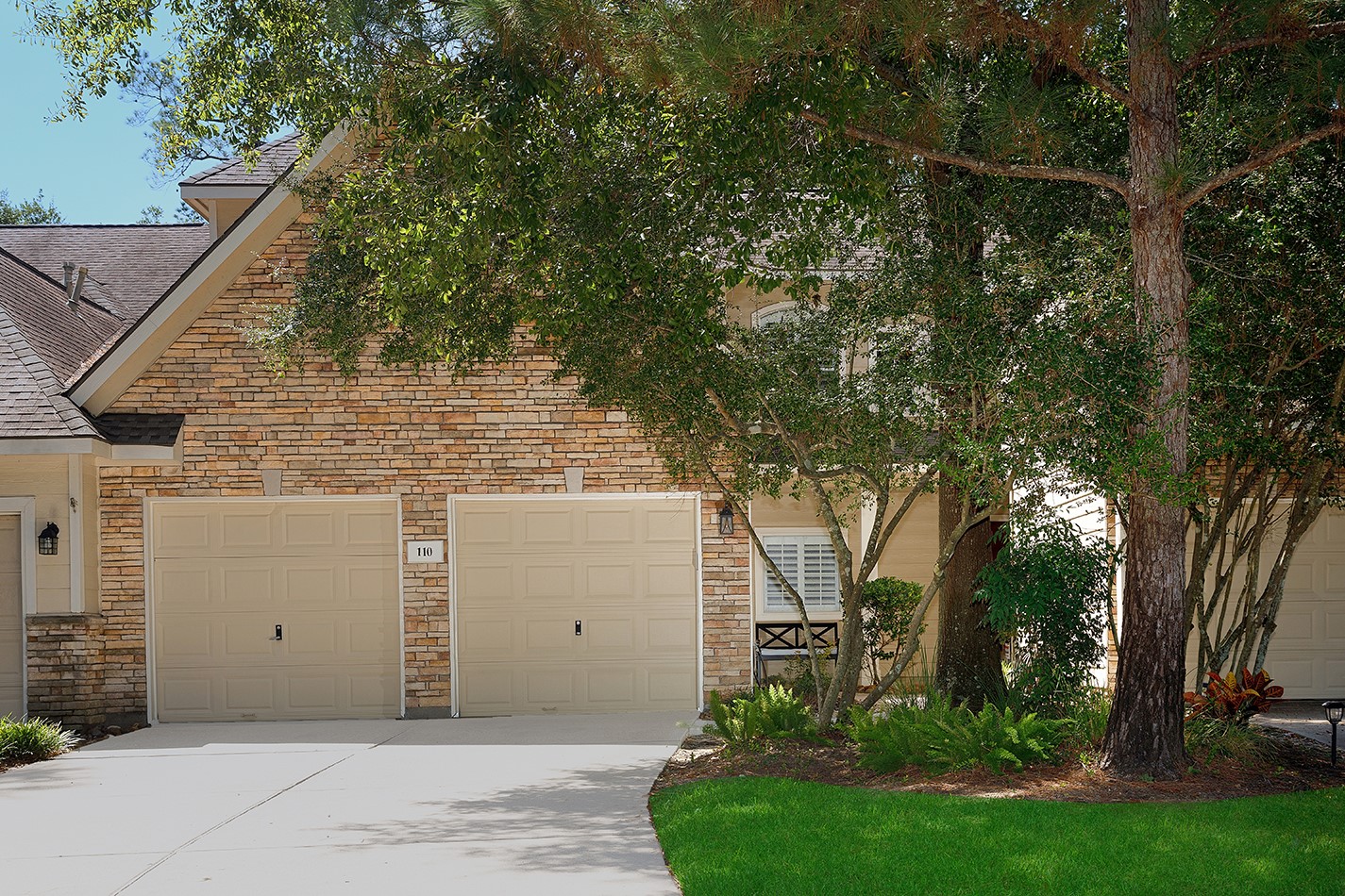 110 Wintergreen Trail The Woodlands, TX 77382 - Photo 3 of 32 a view of a house with a tree