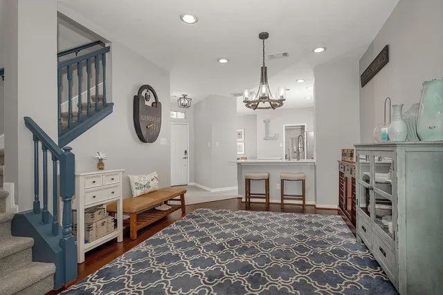 a very nice looking dining room with a baby crib