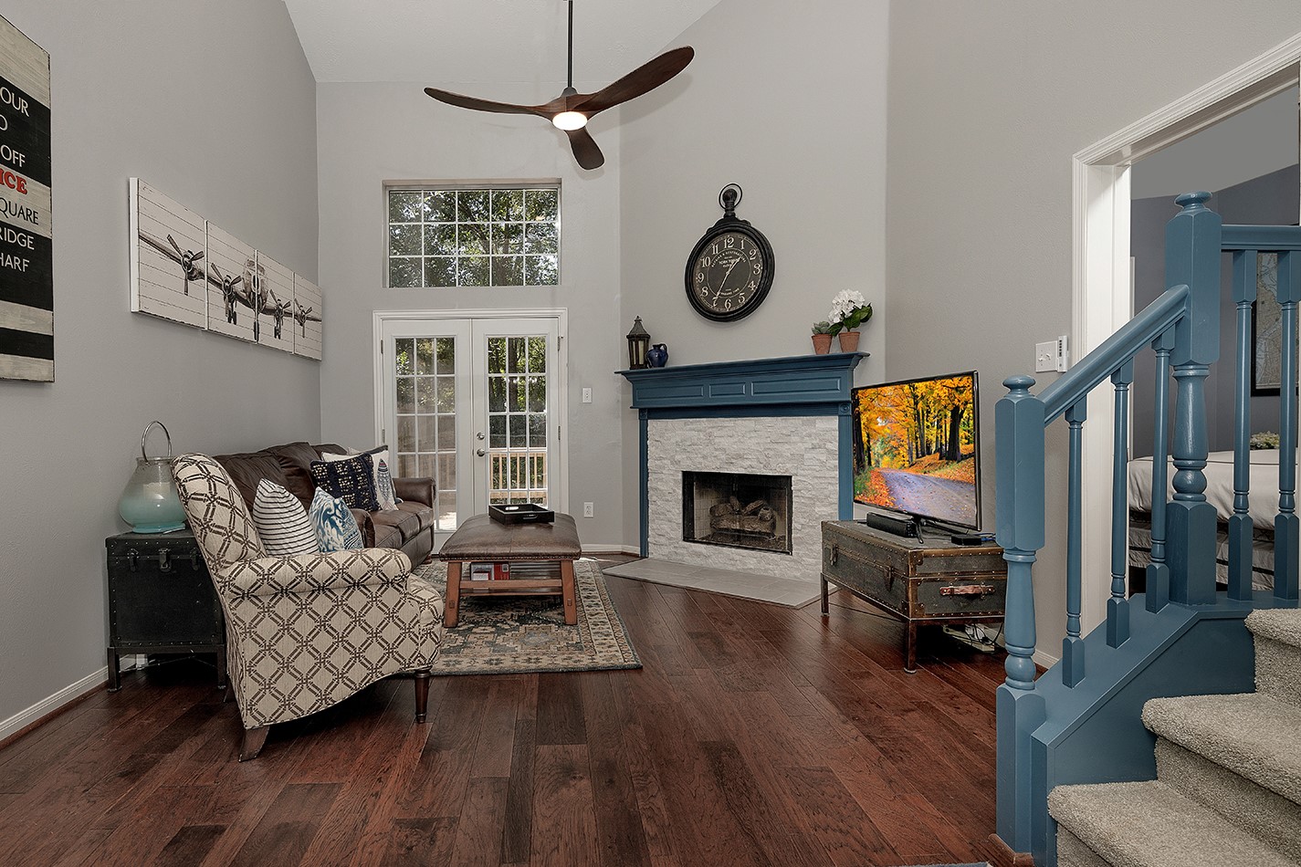 110 Wintergreen Trail The Woodlands, TX 77382 - Photo 7 of 32 a living room with furniture and a fireplace