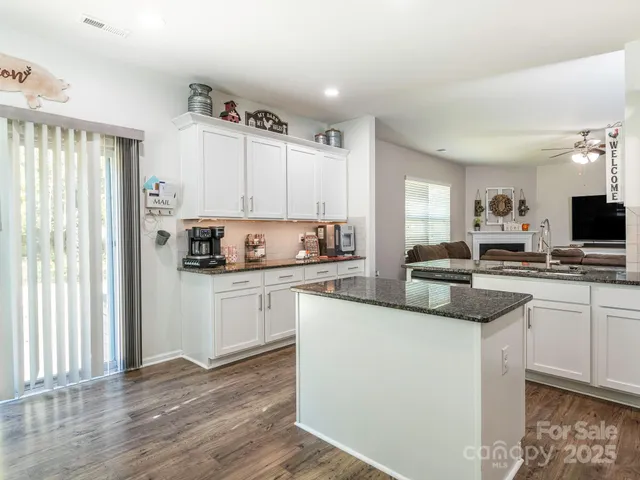 a kitchen with a sink cabinets and window