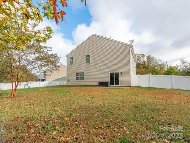 a view of big yard with an outdoor space