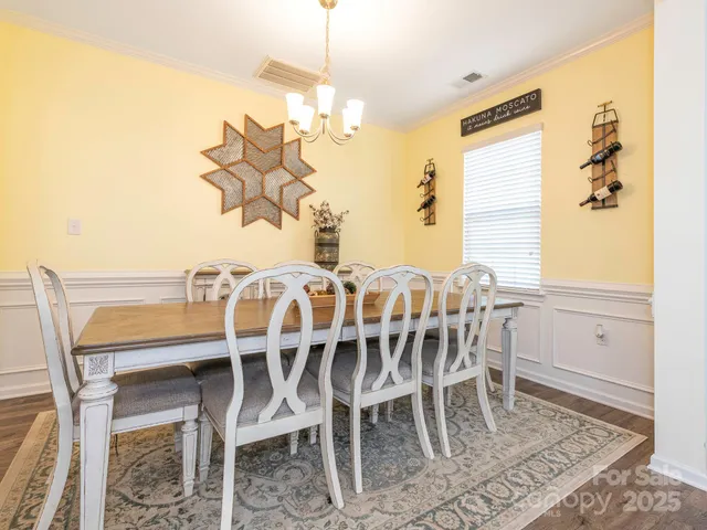 a view of a dining room with furniture and window
