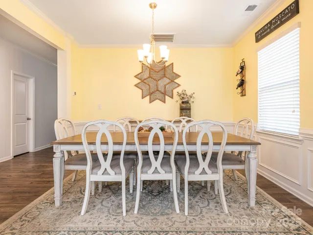 a view of a dining room with furniture and window