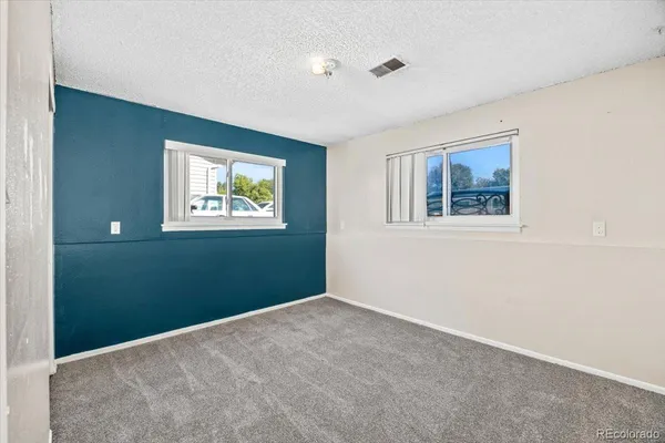 a view of empty room with windows