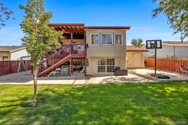 a house view with a sitting space and garden