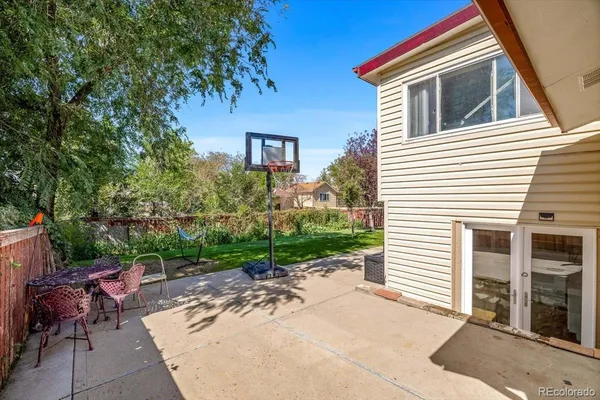 a view of a backyard with sitting area