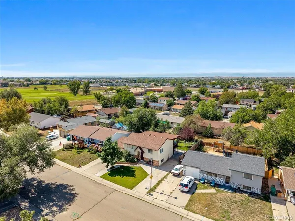an aerial view of a house with a garden
