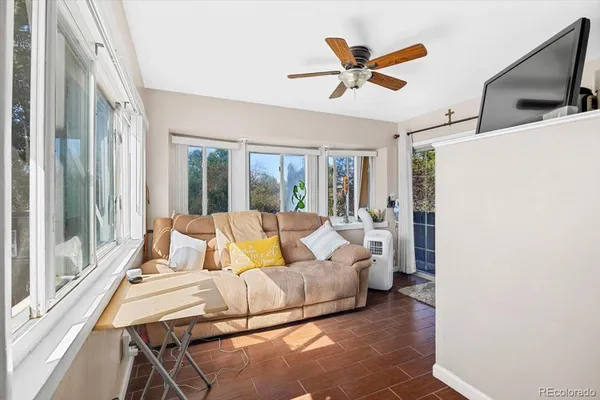 a living room with furniture and a window