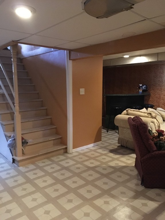 119 Fargo Street Springfield, MA 01119 - Photo 13 of 23 a bedroom with a bed and a walk in closet
