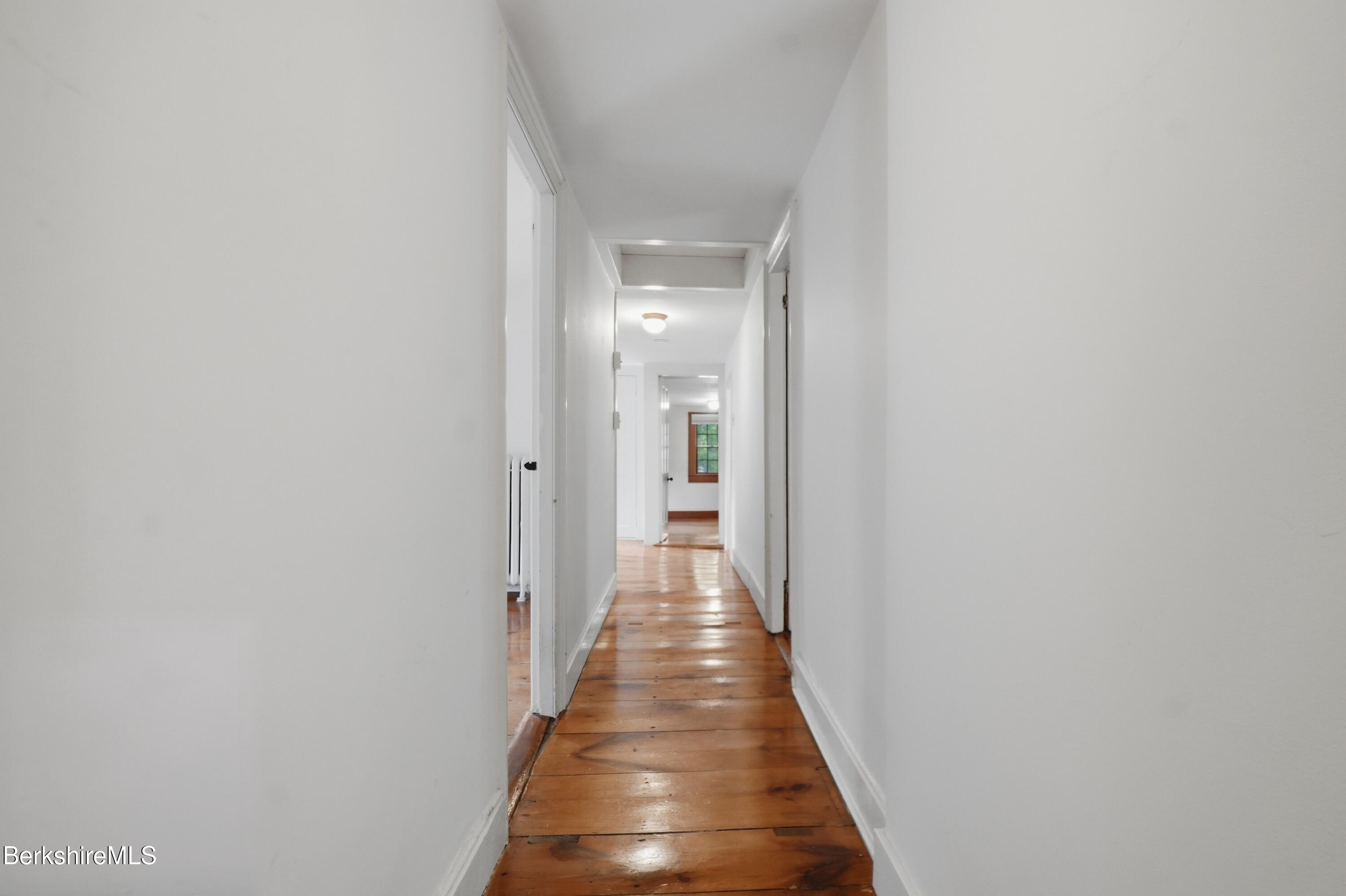 4 Stockbridge Road West Stockbridge, MA 01266 - Photo 49 of 94 a view of a hallway with wooden floor and staircase