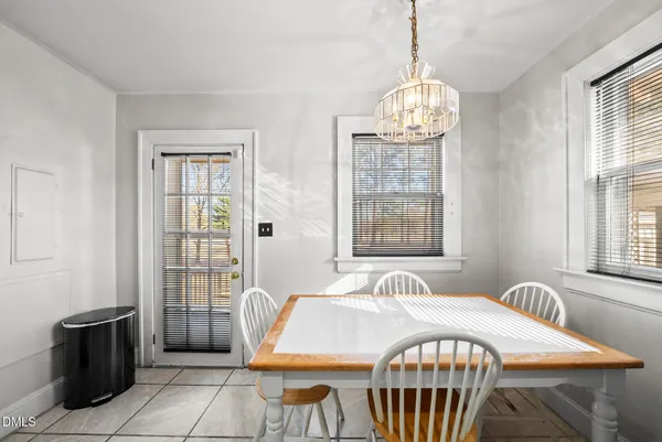 a view of a dining room with furniture and window
