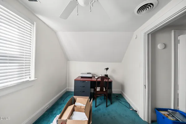 a view of workspace with furniture and window