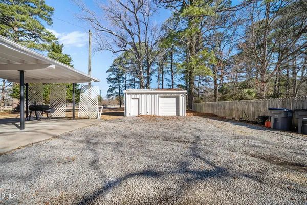 a view of a house with a yard and garage