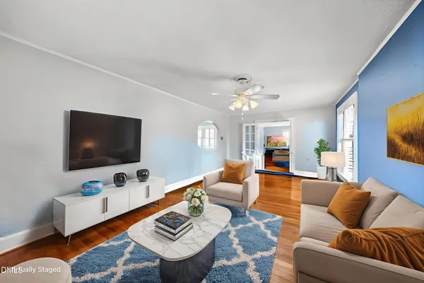 a living room with furniture and a flat screen tv