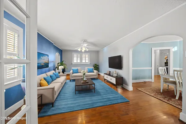 a living room with furniture and a flat screen tv