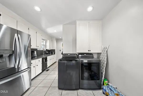 a kitchen with stainless steel appliances granite countertop a stove and a refrigerator