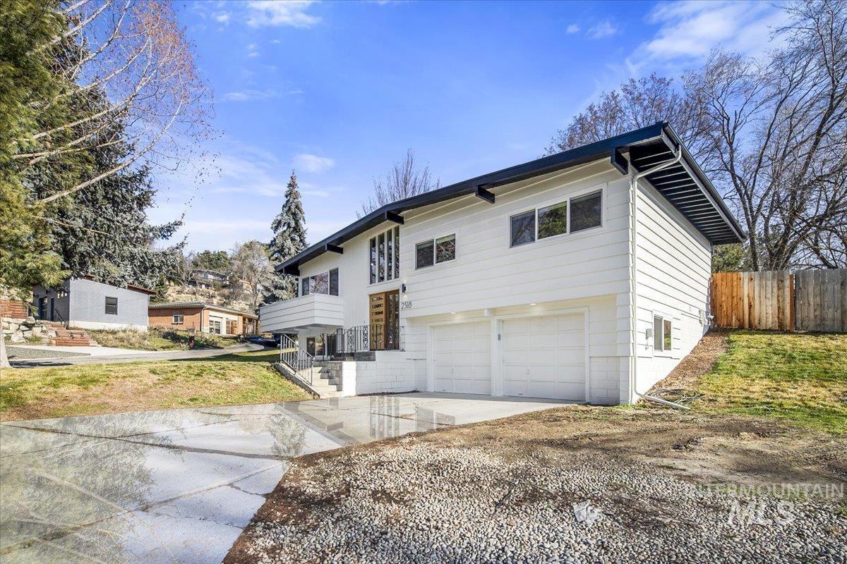 2518 Lancaster Drive Boise, ID 83702 - Photo 2 of 41 Raised ranch featuring driveway and a garage