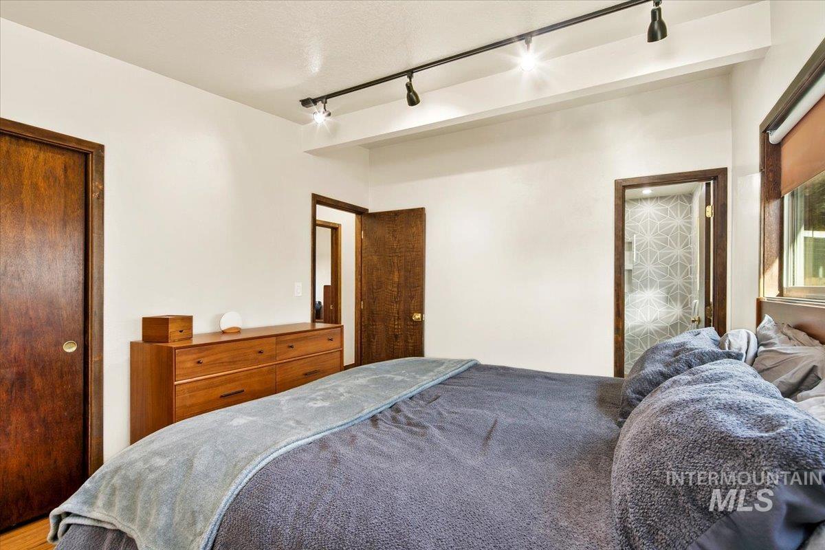 2518 Lancaster Drive Boise, ID 83702 - Photo 24 of 41 Bedroom with rail lighting and a closet