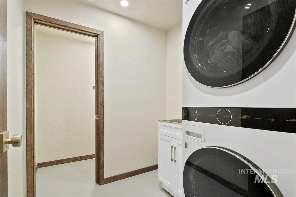 2518 Lancaster Drive Boise, ID 83702 - Photo 35 of 41 Laundry room featuring baseboards and stacked washer and clothes dryer