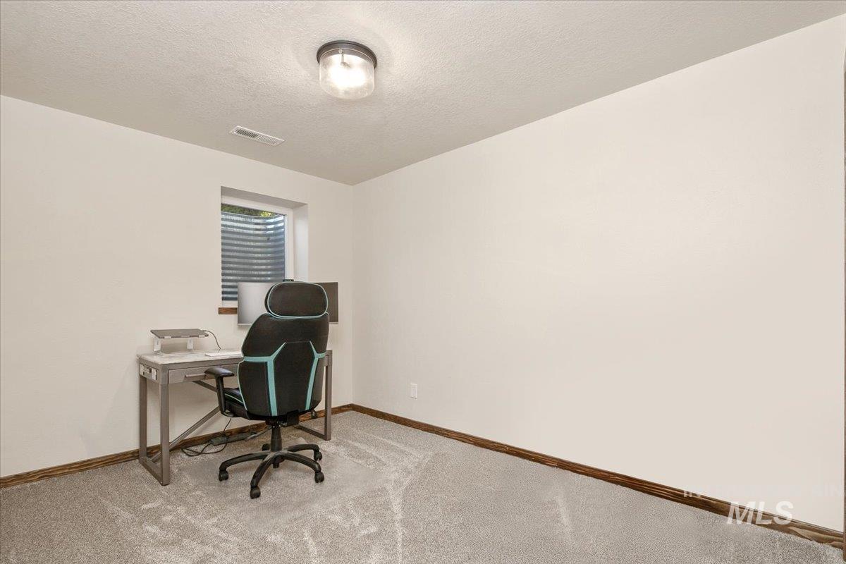 2518 Lancaster Drive Boise, ID 83702 - Photo 37 of 41 Carpeted office with baseboards and a textured ceiling