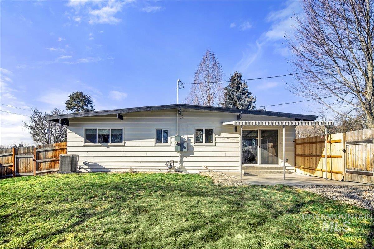 2518 Lancaster Drive Boise, ID 83702 - Photo 40 of 41 Back of property featuring a fenced backyard and a patio